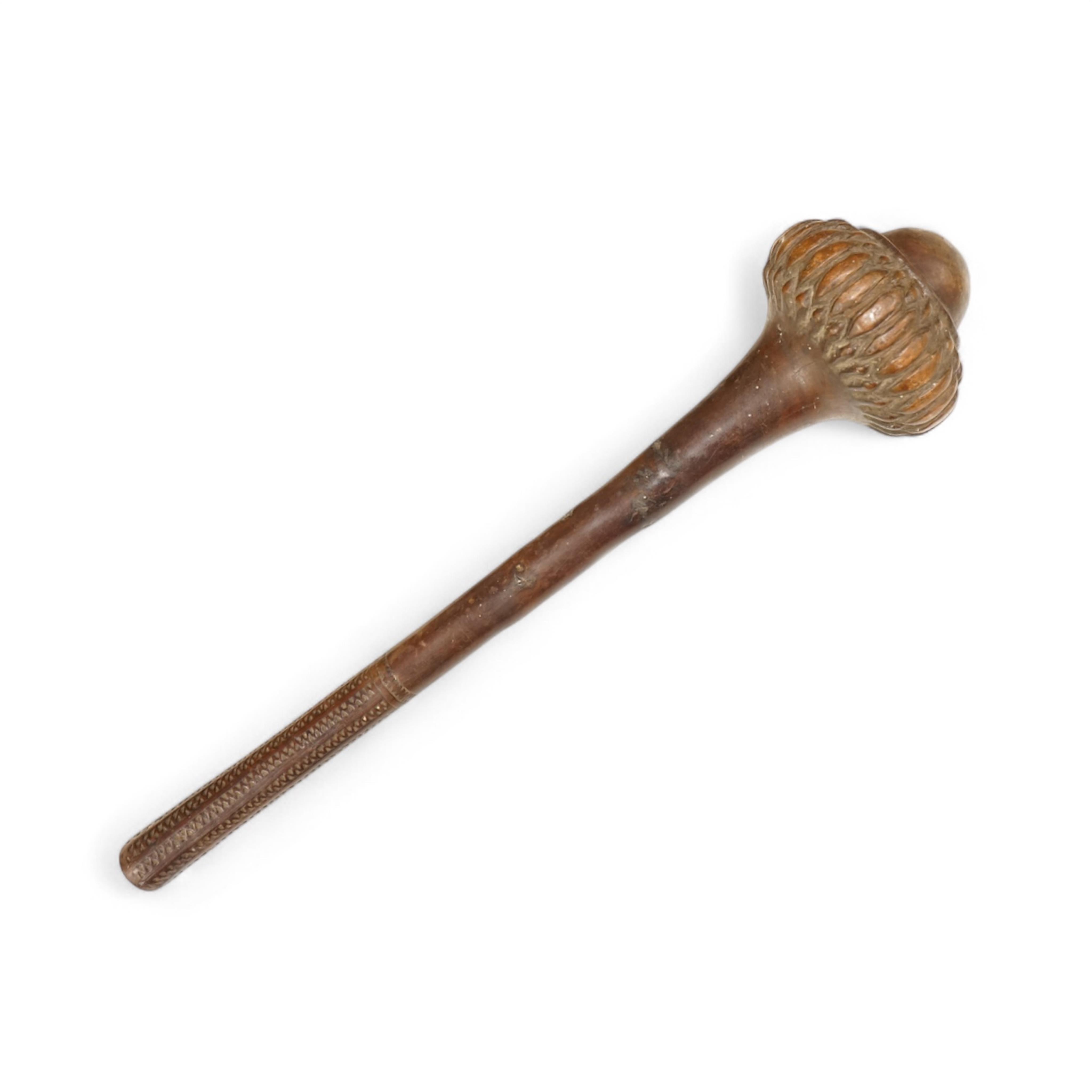 An African tribal knobkerrie with incised decoration to the handle